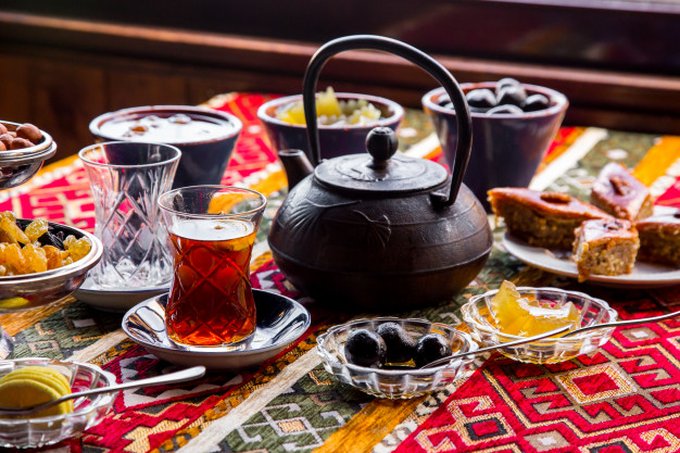 side view cast iron teapot with jam and a cup of tea 141793 4803